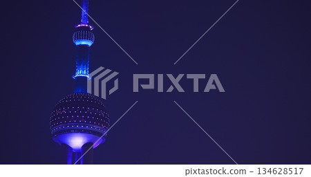 Close-up view of iconic Oriental Pearl Tower illuminated at night. 134628517