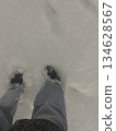 Feet buried in fresh snow 134628567