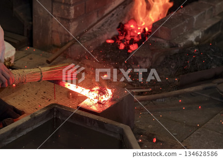 Sparks fly as Japanese swords are forged Sparks fly as Japanese swords are forged 134628586