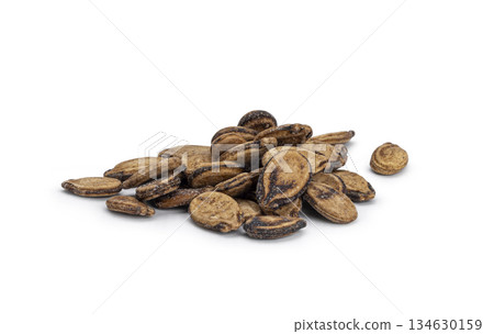 Pile of dried watermelon seeds on white background Pile of dried watermelon seeds on white background 134630159