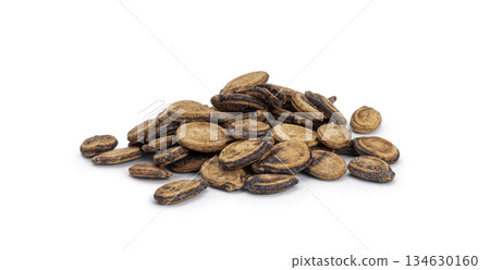 Pile of dried watermelon seeds on white background 134630160