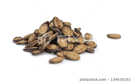Pile of dried watermelon seeds on white background Pile of dried watermelon seeds on white background 134630161