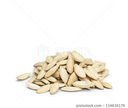 Pile of roasted salted pumpkin seeds on white background 134630170
