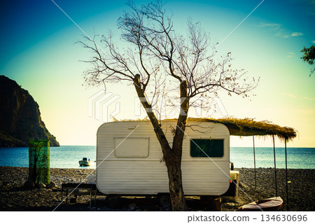 Caravan trailer on sunny beach 134630696