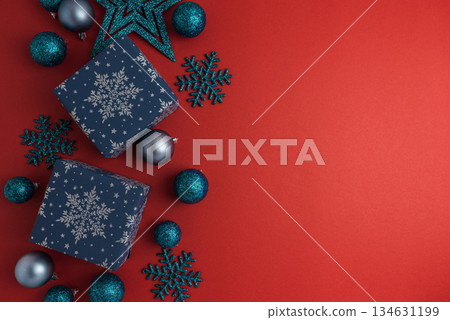 Blue Christmas Gift Boxes and Ornaments on Red Holiday Background 134631199