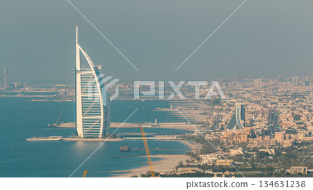 Aerial View of Jumeirah Beach and Dubai skyline with Burj Al Arab at evening timelapse, UAE Aerial View of Jumeirah Beach and Dubai skyline with Burj Al Arab at evening timelapse, UAE 134631238