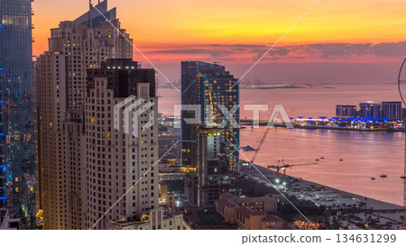 JBR and Dubai marina after sunset aerial day to night timelapse 134631299