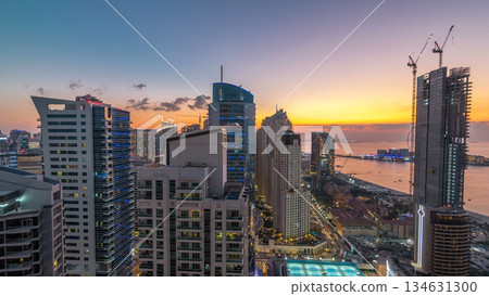 JBR and Dubai marina after sunset aerial day to night timelapse 134631300