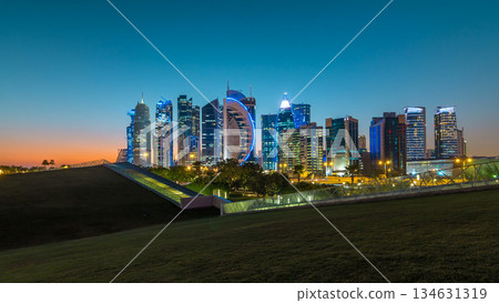 The high-rise district of Doha day to night timelapse after sunset 134631319