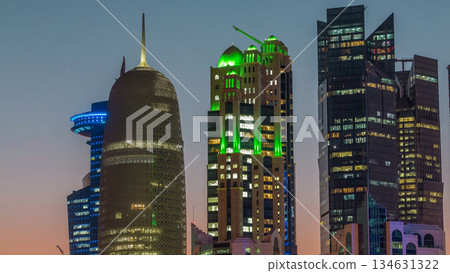 The high-rise district of Doha day to night timelapse after sunset 134631322
