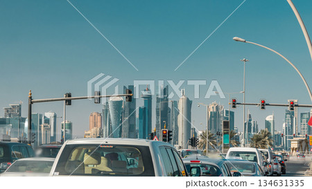 Doha skyline and traffic jam on the intersection timelapse in Doha, Qatar, Middle East. 134631335