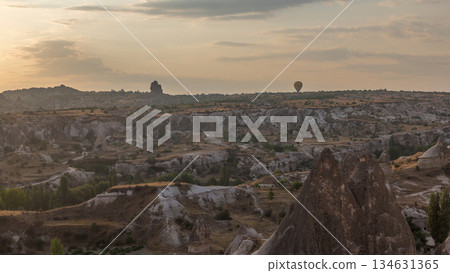Colorful hot air balloons flying in clear morning sky with orange clouds aerial timelapse in Cappadocia, Turkey 134631365