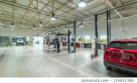 Cars moves on lifts in modern service station and men repair cars timelapse hyperlapse. Cars moves on lifts in modern service station and men repair cars timelapse hyperlapse. 134631366