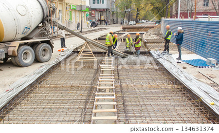 Concrete works for road maintenance construction site with many workers and mixer timelapse Concrete works for road maintenance construction site with many workers and mixer timelapse 134631374