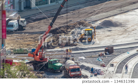 Concrete works for road construction with many workers and mixer timelapse Concrete works for road construction with many workers and mixer timelapse 134631396
