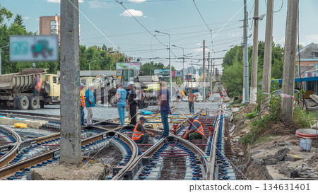 Repair works on the street timelapse. Laying of new tram rails on a city street. 134631401