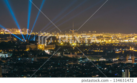 Famous light show and magic fountains timelapse hyperlapse in front of the National Art Museum at Placa Espanya in Barcelona at night, Catalonia, Spain 134631472