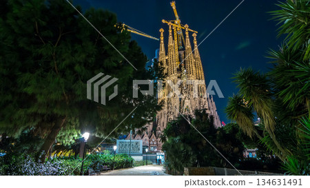 Sagrada Familia, a large church in Barcelona, Spain night timelapse hyperlapse. 134631491