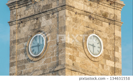 Clock tower in the Historic part of Antalya Kaleici timelapse, Turkey. Old town of Antalya is a popular destination among tourists Clock tower in the Historic part of Antalya Kaleici timelapse, Turkey. Old town of Antalya is a popular destination among tourists 134631558