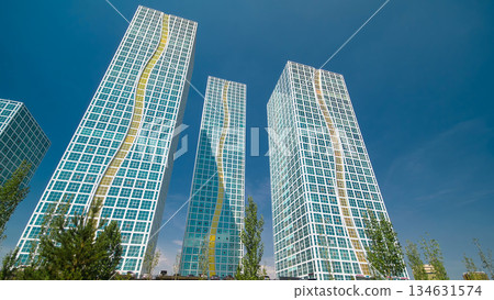 Modern towers of residential complex near Ishim River timelapse hyperlapse in Astana 134631574