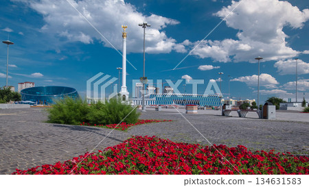 Stele monument Kazakh Eli with bird Samruk and Palace of Independence timelapse hyperlapse. 134631583