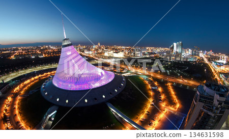 Elevated aerial view over the city center with Khan Shatyr day to night timelapse, Kazakhstan, Astana Elevated aerial view over the city center with Khan Shatyr day to night timelapse, Kazakhstan, Astana 134631598