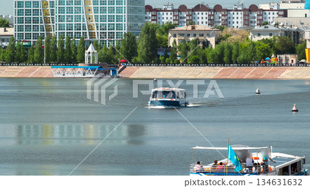 Astana, Kazakhstan. Pleasure boat on the river Ishim timelapse hyperlapse in Astana. 134631632
