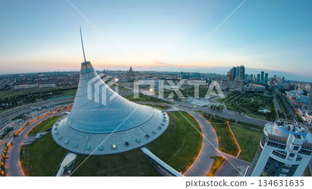Elevated view over the city center with Khan Shatyr and central business district night to day timelapse, Kazakhstan, Astana Elevated view over the city center with Khan Shatyr and central business district night to day timelapse, Kazakhstan, Astana 134631635
