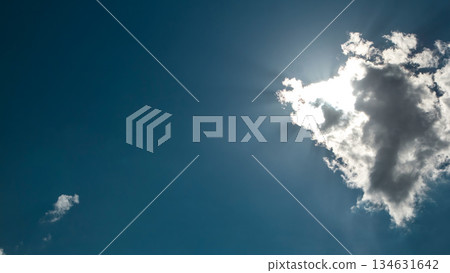 Beautiful cloudscape timelapse with large, building clouds and sunrise breaking through cloud mass. Beautiful cloudscape timelapse with large, building clouds and sunrise breaking through cloud mass. 134631642