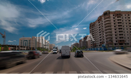Car drives on street Traffic over the wide boulevards of Astana timelapse hyperlapse drivelapse in Kazakhstan 134631645