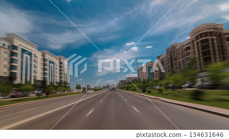 Car drives on street Traffic over the wide boulevards of Astana timelapse hyperlapse drivelapse in Kazakhstan 134631646