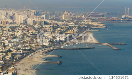 Panoramic view of Sharjah coastline from Ajman rooftop timelapse - third largest and most populous city in United Arab Emirates 134631671