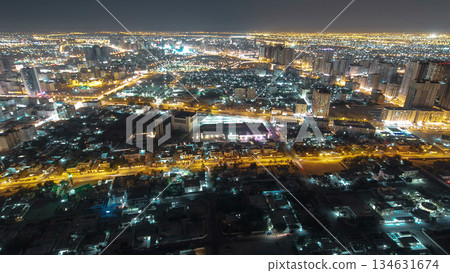 Cityscape of Ajman from rooftop night aerial timelapse 134631674
