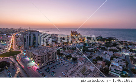Cityscape of Ajman and Sharjah day to night timelapse from top 134631692