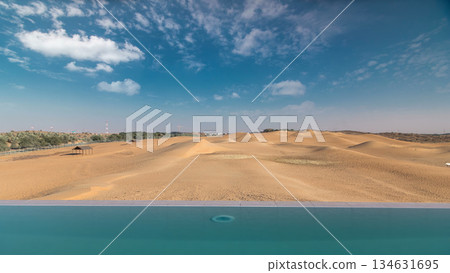 Yellow desert dunes and sky timelapse hyperlapse. Yellow desert dunes and sky timelapse hyperlapse. 134631695