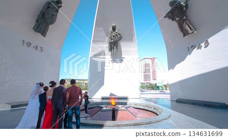 Stela with portraits of Mangistau heroes of the Great Patriotic War at the Eternal Flame timelapse hyperlapse 134631699