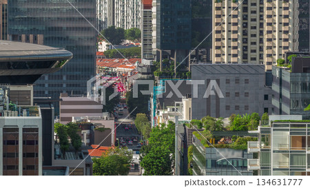 Traffic with cars on a street and urban scene in the central district of Singapore timelapse Traffic with cars on a street and urban scene in the central district of Singapore timelapse 134631777