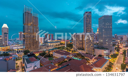 Evening panorama with Marina Bay area and skyscrapers city skyline aerial day to night timelapse. Evening panorama with Marina Bay area and skyscrapers city skyline aerial day to night timelapse. 134631797