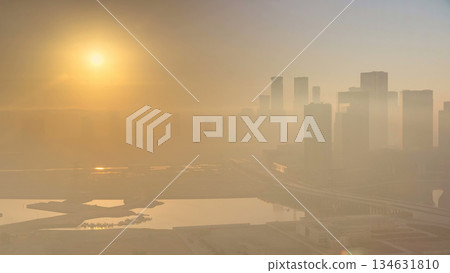 Abu Dhabi city skyline with skyscrapers at sunrise from above timelapse Abu Dhabi city skyline with skyscrapers at sunrise from above timelapse 134631810