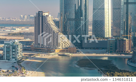 Buildings on Al Reem island in Abu Dhabi timelapse from above. Buildings on Al Reem island in Abu Dhabi timelapse from above. 134631811