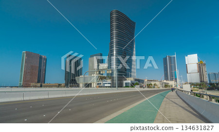Modern buildings in Abu Dhabi skyline timelapse hyperlapse with waterfront. 134631827