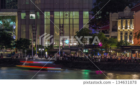 Singapore quay with tall skyscrapers in the central business district on Boat Quay day to night timelapse 134631878