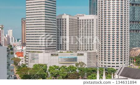 Skyscrapers near St. Andrew's Cathedral aerial timelapse. It is an Anglican cathedral in Singapore, the country's largest cathedral. Skyscrapers near St. Andrew's Cathedral aerial timelapse. It is an Anglican cathedral in Singapore, the country's largest cathedral. 134631894
