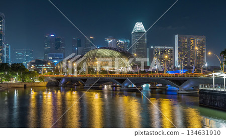Illuminated Double Esplanade Theatres domes behind Esplanade Drive with traffic night timelapse hyperlapse 134631910