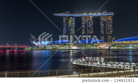 The Merlion fountain spouts water in front of the Marina Bay Sands hotel in Singapore timelapse hyperlapse. The Merlion fountain spouts water in front of the Marina Bay Sands hotel in Singapore timelapse hyperlapse. 134631911