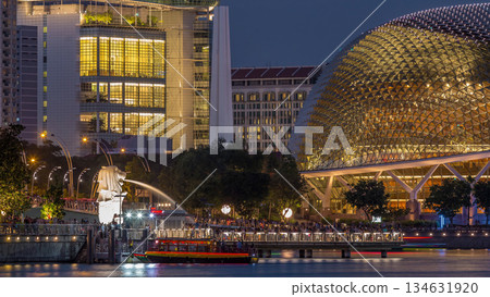 The Esplanade Theatres on the Bay in Singapore at dusk, with beautiful reflection in water day to night timelapse 134631920