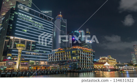 Business Financial Downtown City and Skyscrapers Tower Building at Marina Bay night timelapse hyperlapse, Singapore Business Financial Downtown City and Skyscrapers Tower Building at Marina Bay night timelapse hyperlapse, Singapore 134631922