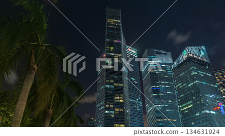 Looking up perspective of modern business skyscrapers glass and sky view landscape of commercial building in central city timelapse hyperlapse 134631924