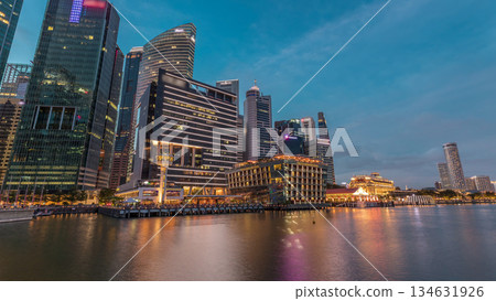 Business Financial Downtown City and Skyscrapers Tower Building at Marina Bay day to night timelapse, Singapore Business Financial Downtown City and Skyscrapers Tower Building at Marina Bay day to night timelapse, Singapore 134631926