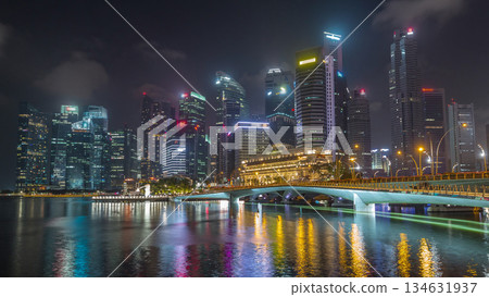 Esplanade bridge and downtown core skyscrapers in the background Singapore night timelapse hyperlapse 134631937